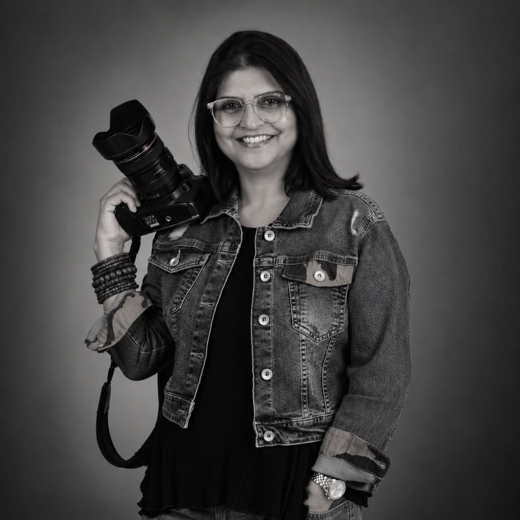 Portrait of Gurmeet Kaur holding a camera